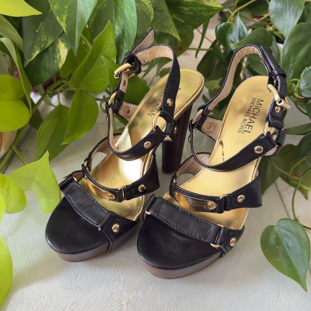 Michael Kors black leather platform heels with gold-tone hardware, stud details